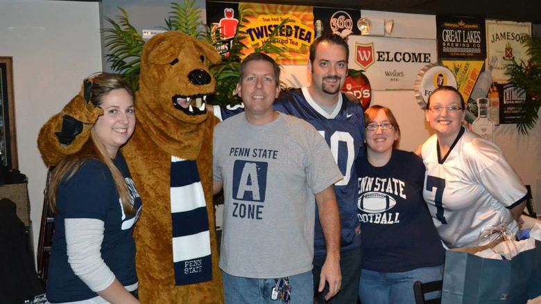 Fans with the Nittany Lion