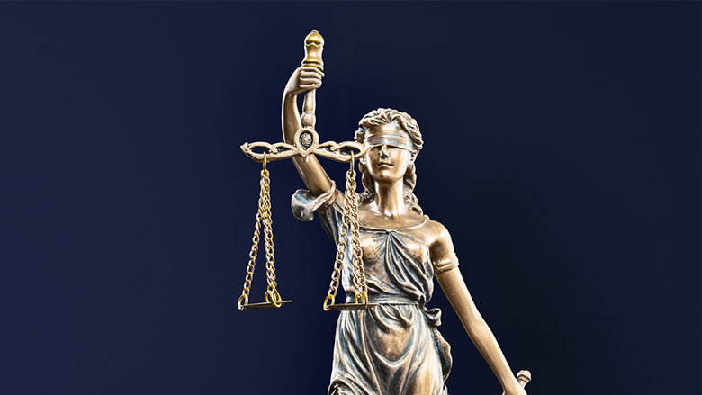 A statue of Lady Justice holding scales.