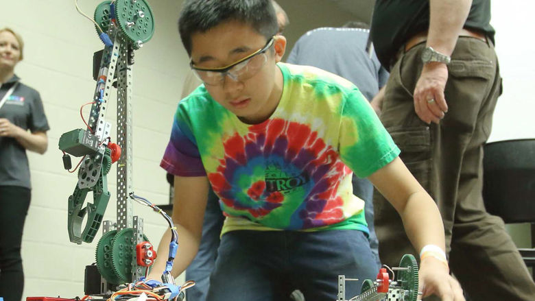 Science Olympiad student working on robot