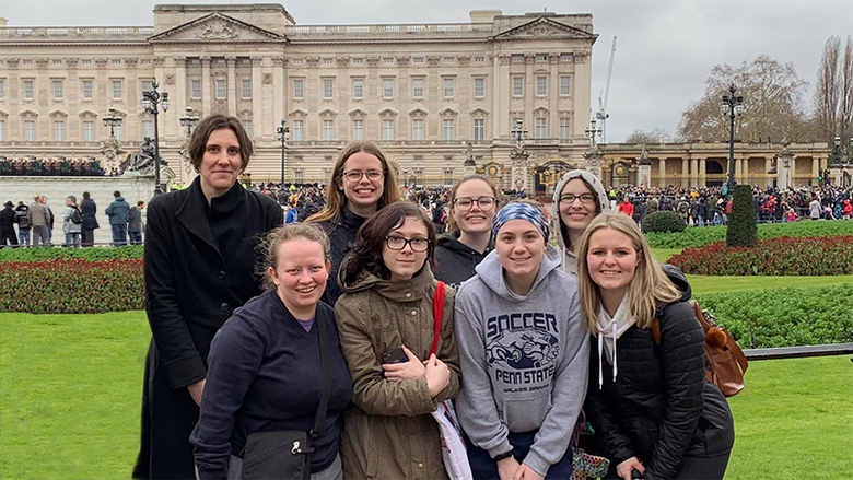  Seven Penn State Wilkes-Barre honors students and their adviser in front of Buckingham Palace
