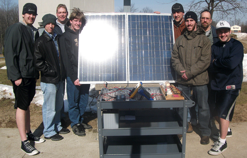 Engineering students working with solar panels