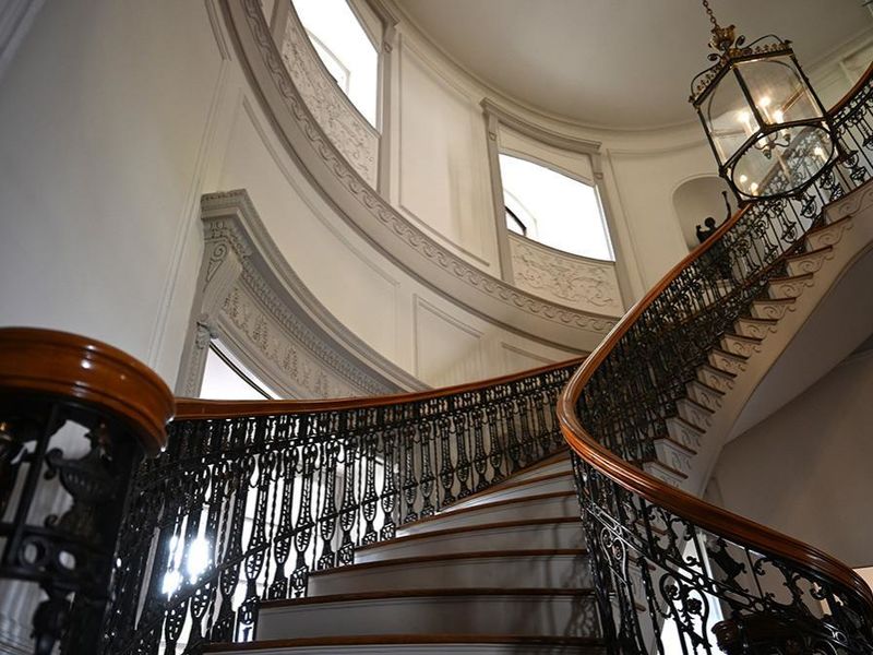 A photo of a grand staircase inside a mansion
