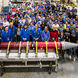 Large group of participants with their completed rocket in the front