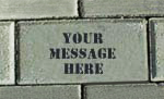 a brick on the Hayfield Pathway with the words "your message here"