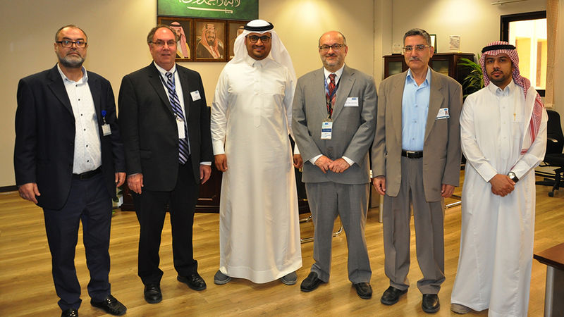 Dr. Albert Lozano visits Saudi Arabia; standing with his hosts