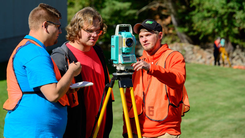Kyle Neiswender with surveying classmates