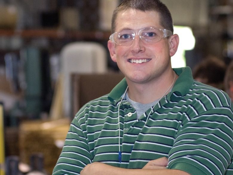 Professional wearing safety glasses in an industrial work environment
