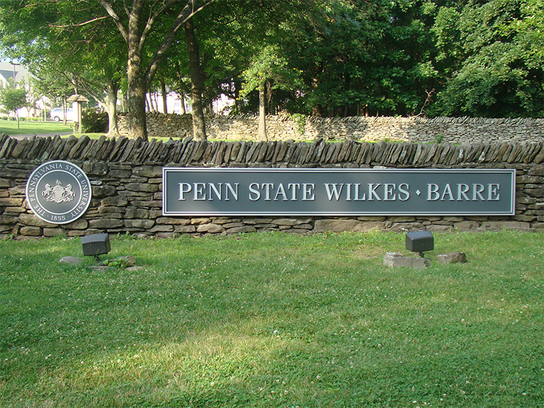 The stone wall at the entrance to the Penn State Wilkes-Barre campus