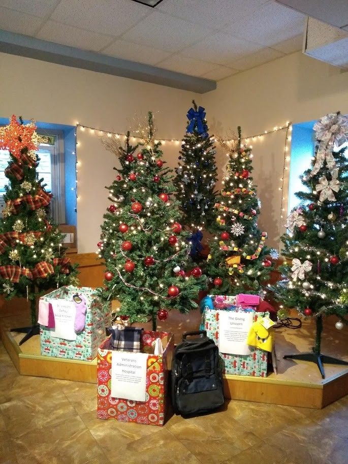 Donation boxes in front of Christmas trees