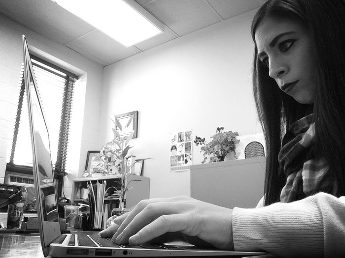 Shawnna on laptop at internship office