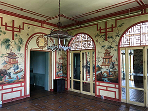 The Chinese Breakfast Room, with original ornate hand-painted walls of Chinese buildings and landscapes.