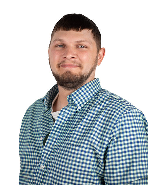 A man in a button-down shirt against a white background.