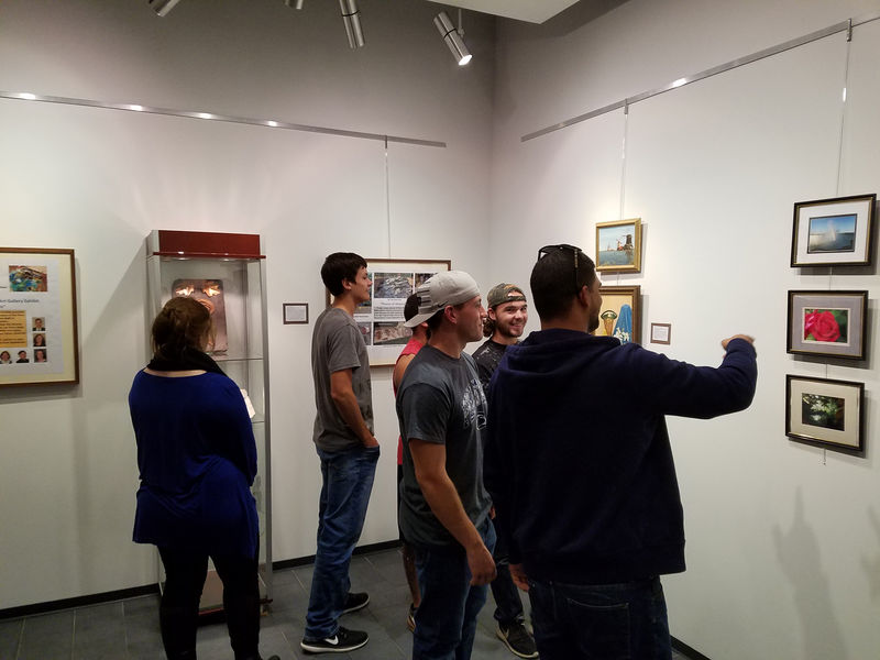 Students looking at art on display