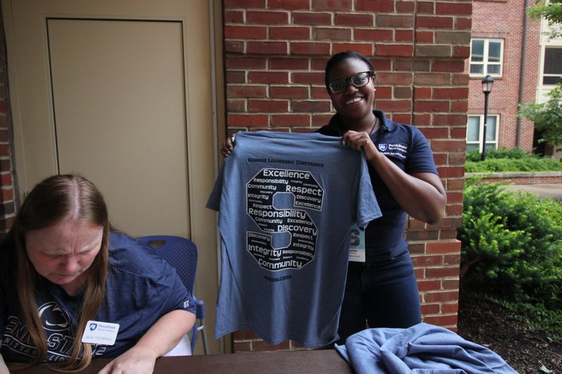 Penn State staff checks-in delegates to the Summer Leadership Conference