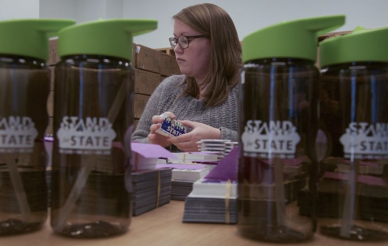 A student organizes stickers
