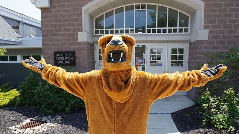 The Nittany Lion standing with open arms.