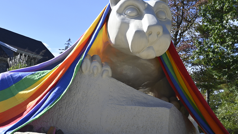 A pride flag draped over the Nittany Lion shrine at Penn State Wilkes-Barre.