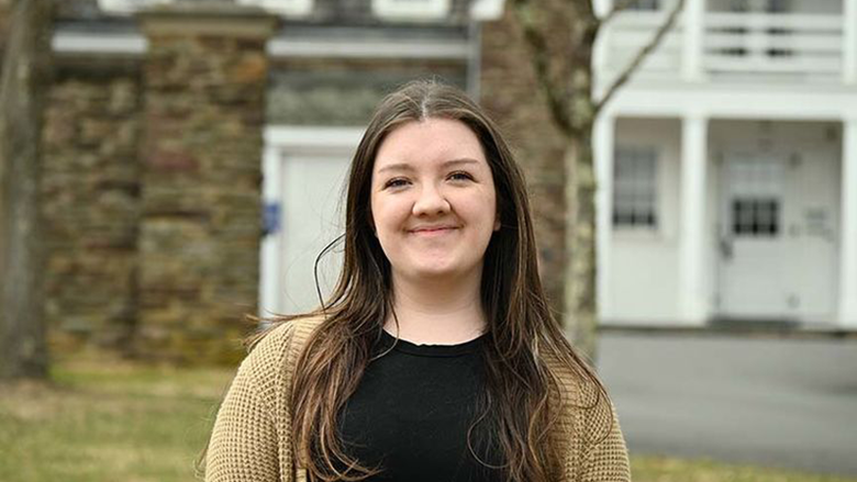 Jada Vanderpool standing in front of Hayfield House