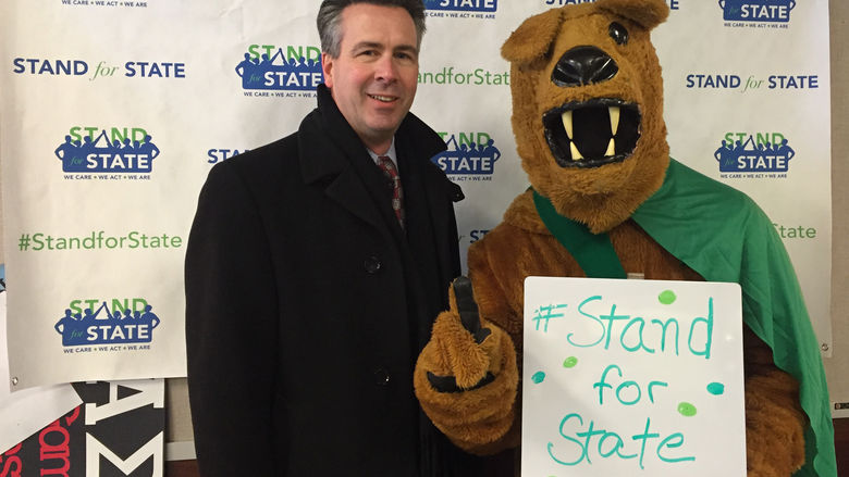 Penn State Behrend Chancellor Ralph Ford and the lion mascot 