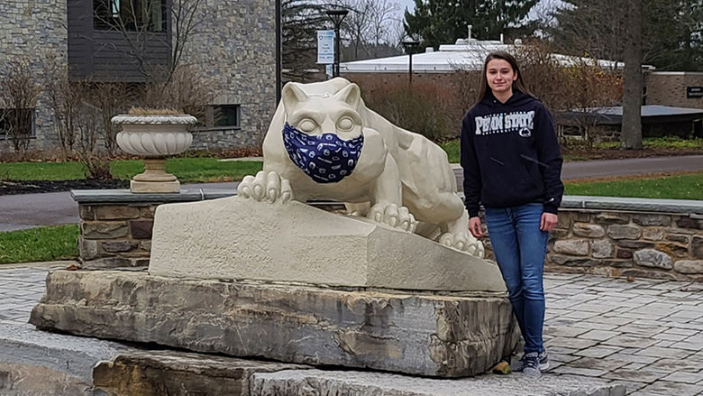 Ashley Tomeo at the Nittany Lion shrine on campus