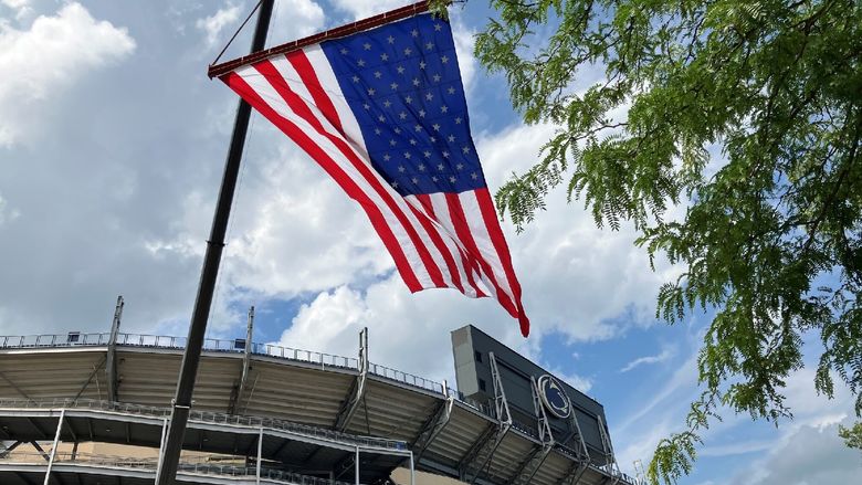 An American flag flies in front of Beaver Stadium