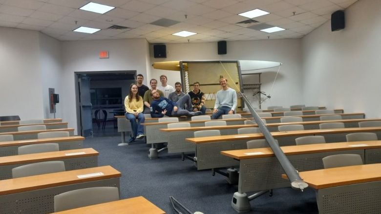 A group of students and professor in a classroom