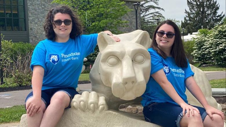 Kayla and Alyssa Hopple at the Penn State Wilkes-Barre lion shrine.