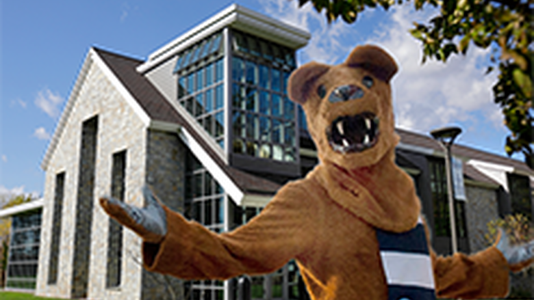 Nittany Lion mascot in front of the Academic Commons