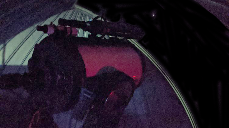 The telescope at the Friedman Observatory viewing Mars on a clear night