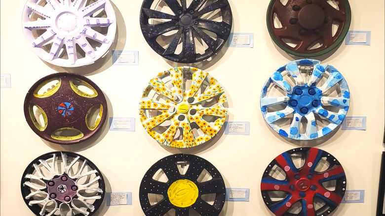 recycled hubcap art from ARTH 112 class