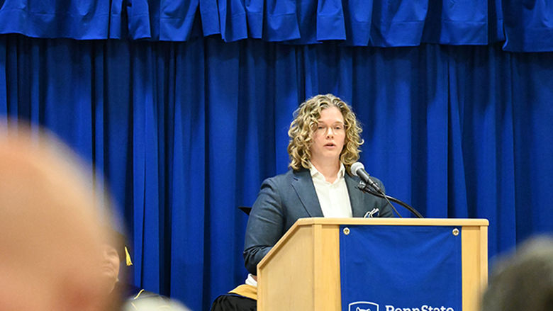 A woman speaking from the podium.