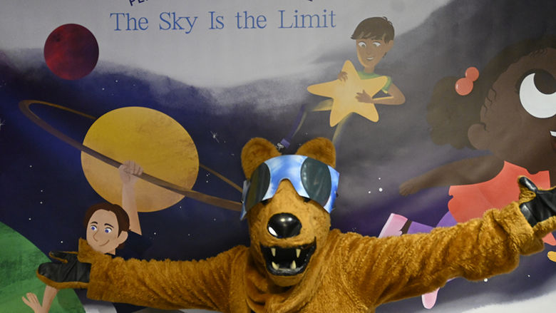 The Nittany Lion mascot wearing solar eclipse glasses.