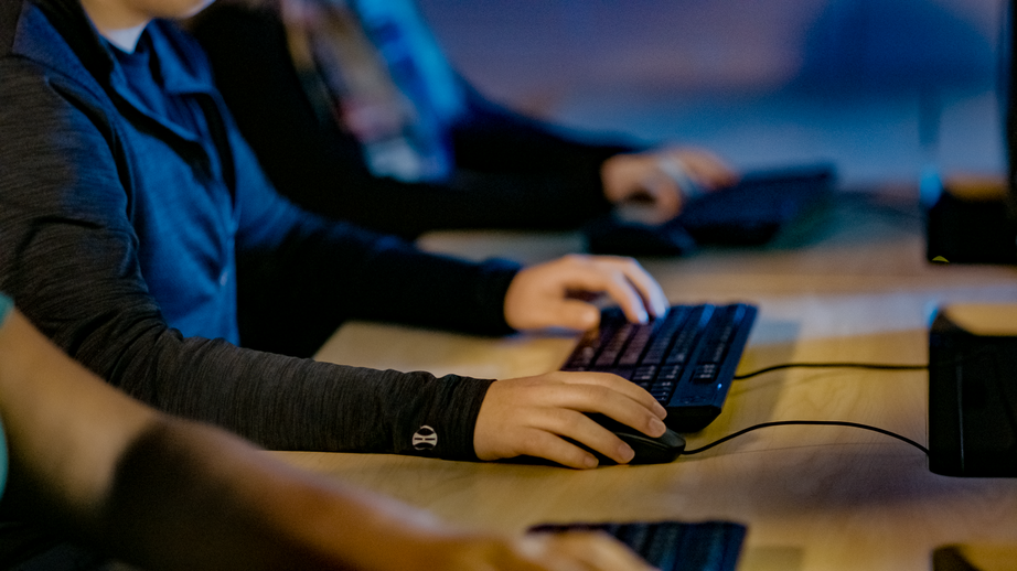 Hands using computer keyboards