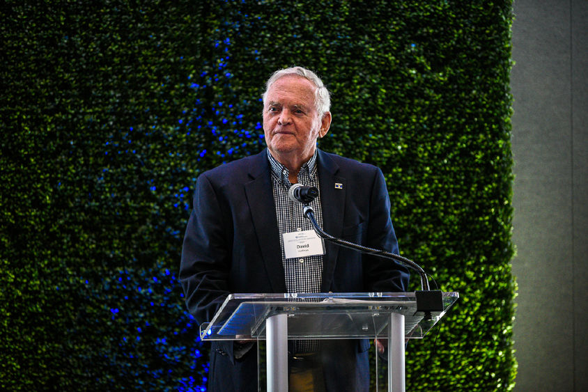 Man standing at podium to accept award