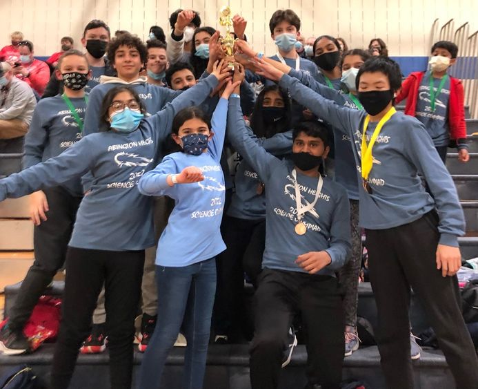 Abington Heights Science Olympiad team hoisting trophy