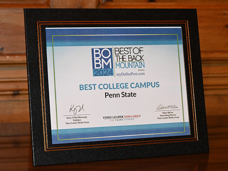 A framed award for the "Best College Campus" award.