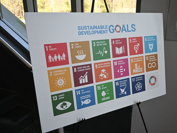 A posterboard with colorful squares, each depicting one of the United Nations' Sustainable Development Goals.