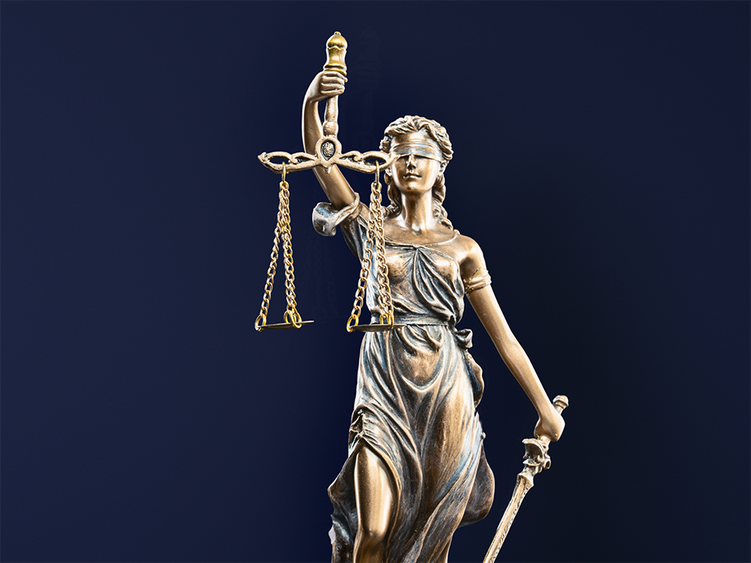 A statue of Lady Justice holding scales.